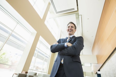 Low angle view of Caucasian businessman standing in office