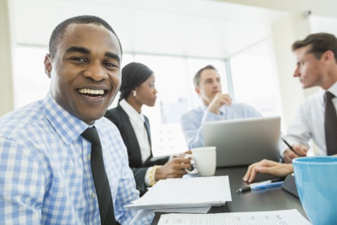 Businessman smiling in meeting