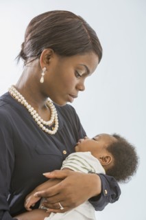 Mother cradling baby son