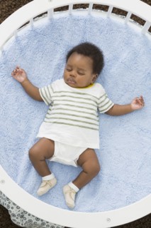 Sleeping baby laying in crib