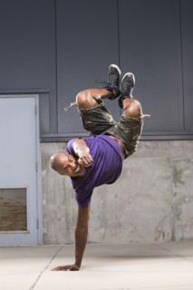 Black dancer balancing on hand