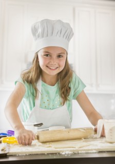 Caucasian girl baking in kitchen