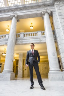 Mixed race businessman standing in courthouse