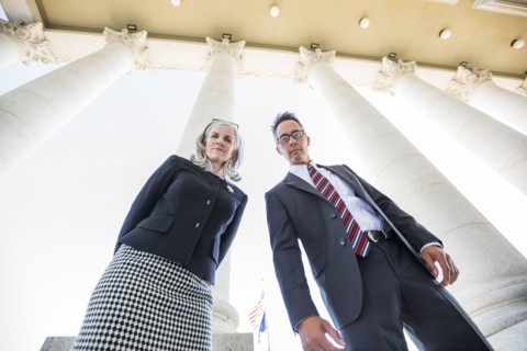 Low angle view of business people under columns