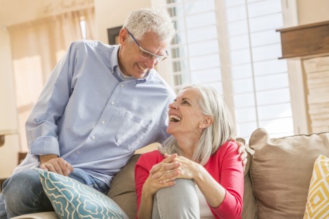 Caucasian couple sitting on sofa