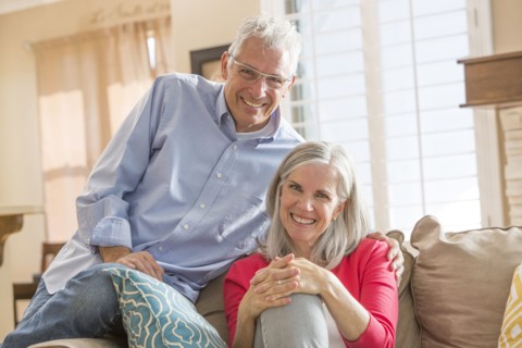 Caucasian couple sitting on sofa