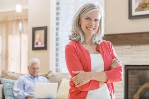 Caucasian woman standing in living room