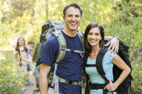 Caucasian family hiking on path