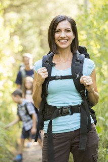 Caucasian family hiking on path