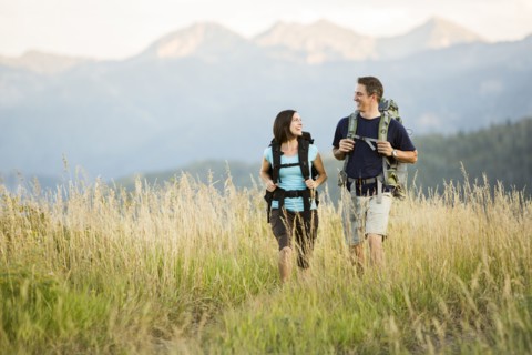 Caucasian couple hiking in remote landscape