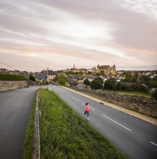 Caucasian woman jogging on road