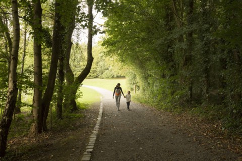 Caucasian mother and son walking in park