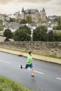 Caucasian man running outdoors