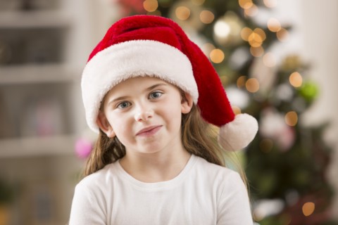 Caucasian girl wearing Santa hat