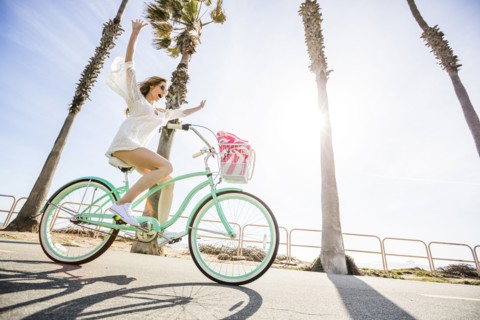Caucasian woman riding bicycle