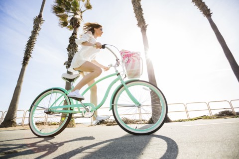Caucasian woman riding bicycle