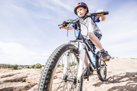Caucasian boy riding mountain bike