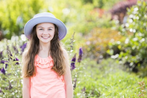 Caucasian girl posing in garden