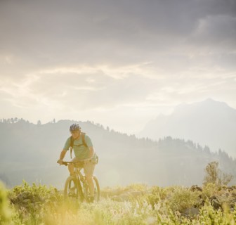 Caucasian man riding mountain bike
