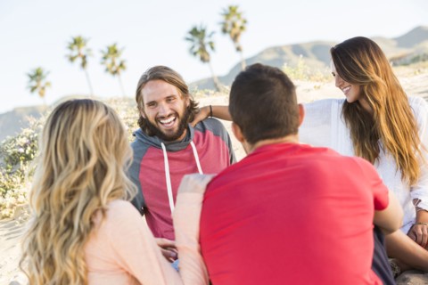 Friends laughing at beach
