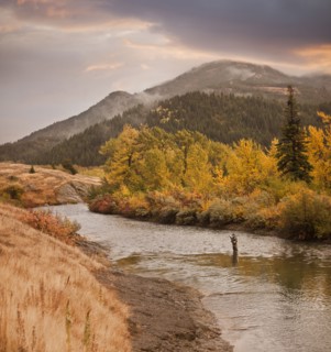 Caucasian man fishing in river