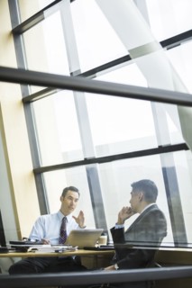 Businessmen talking in meeting