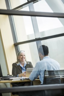 Business people smiling in meeting