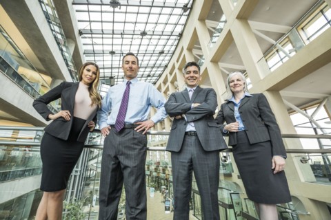 Portrait of smiling business people in lobby
