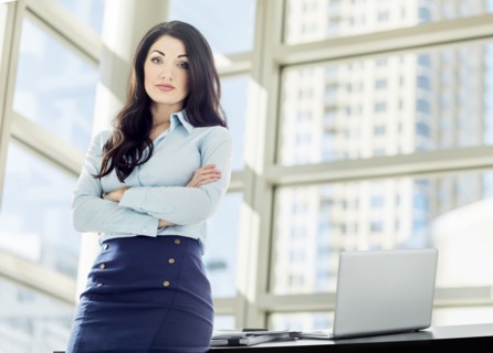 Caucasian businesswoman posing in office