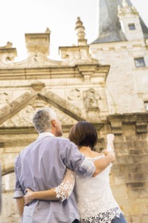 Caucasian couple admiring building
