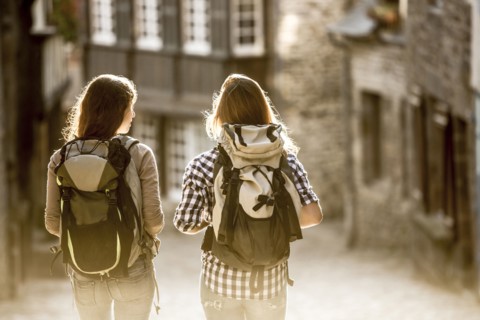 Caucasian women backpacking in city