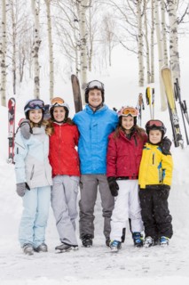 Portrait of smiling Caucasian family on skiing vacation