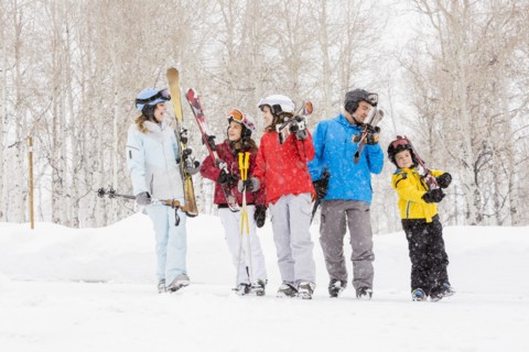 Smiling Caucasian family on skiing vacation