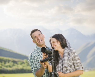 Couple with camera laughing
