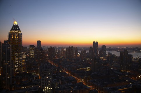 Sunset and illuminated cityscape
