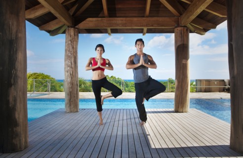 Couple practicing yoga together