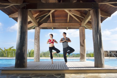 Couple practicing yoga together