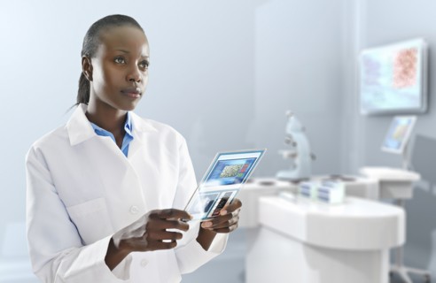 African American doctor using digital tablet in laboratory