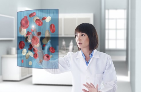 Mixed race doctor using digital display in doctor's office