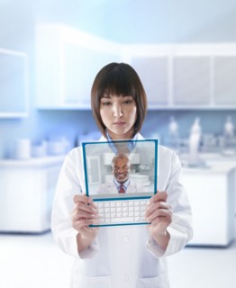 Mixed race doctor using digital tablet in a lab