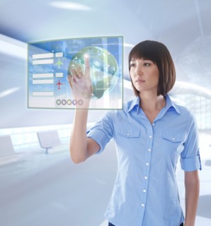 Mixed race businesswoman using digital display
