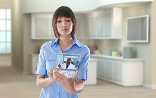 Mixed race woman using digital tablet in office
