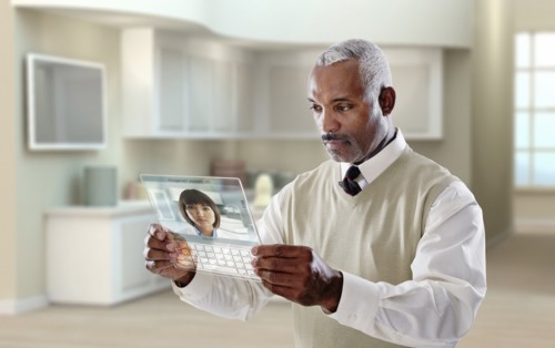 Black businessman using digital tablet in office