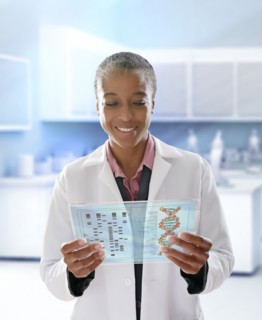 Black doctor using digital tablet in doctor's office