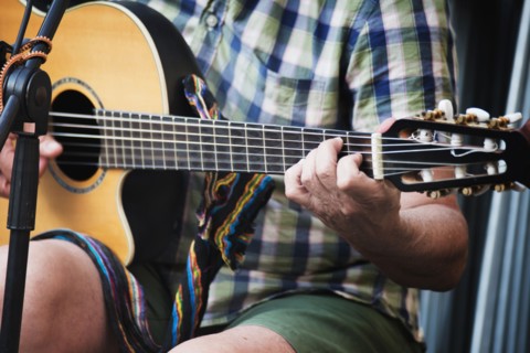 Man sitting and playing guitar