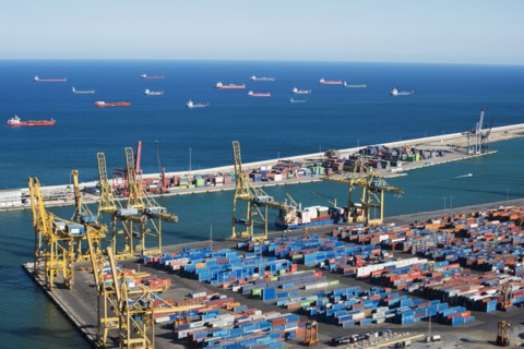 Cargo containers and ships at port