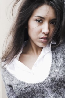 Middle Eastern woman with hair blowing