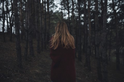 Caucasian woman standing in forest