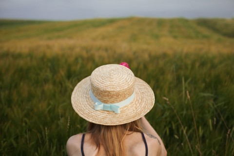 Caucasian woman in field of tall grass