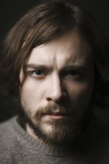 Close up of serious Caucasian man with beard